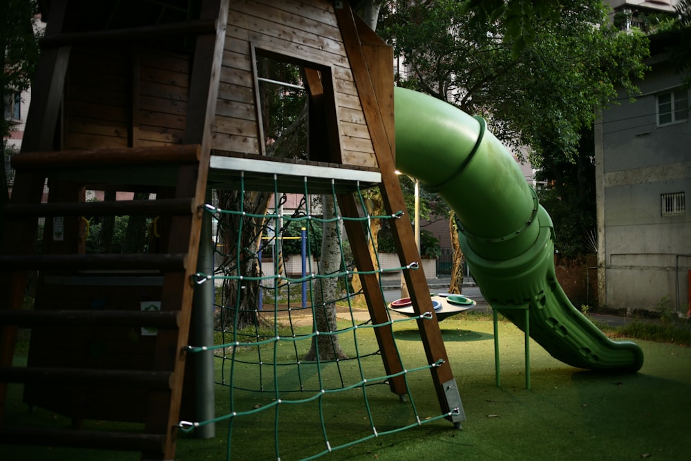 a playground with a slide and climbing frame