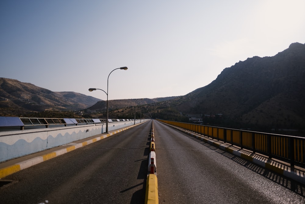 a road with a mountain in the background