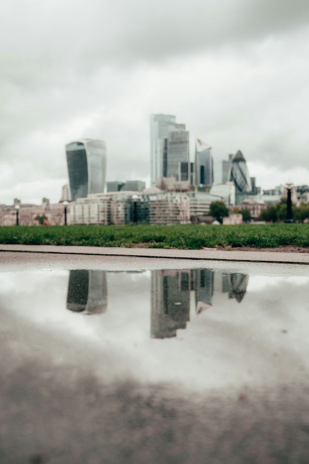 a reflection of a city in the water