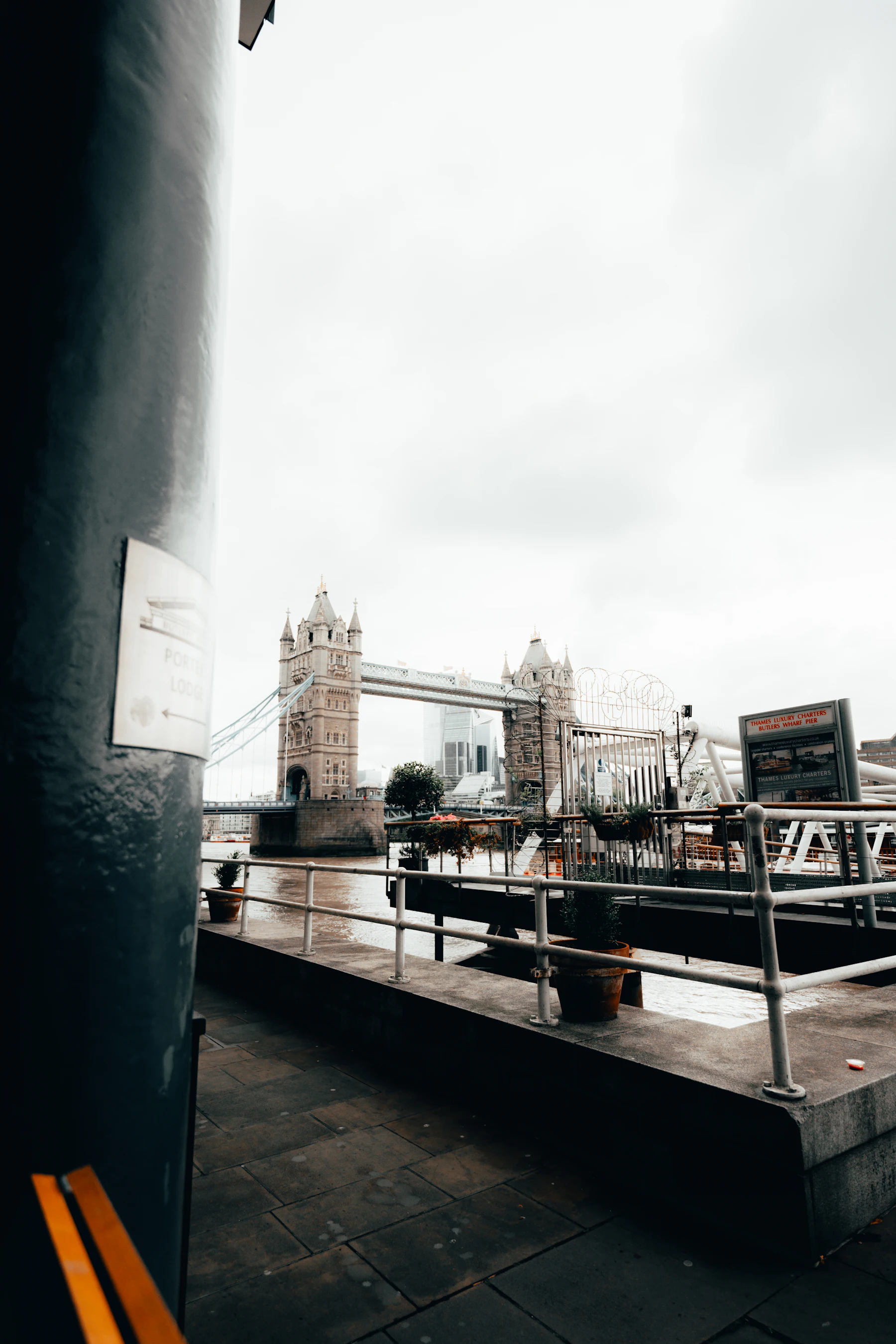 Tower Bridge over the River Thames in London seen from a riverside walkway