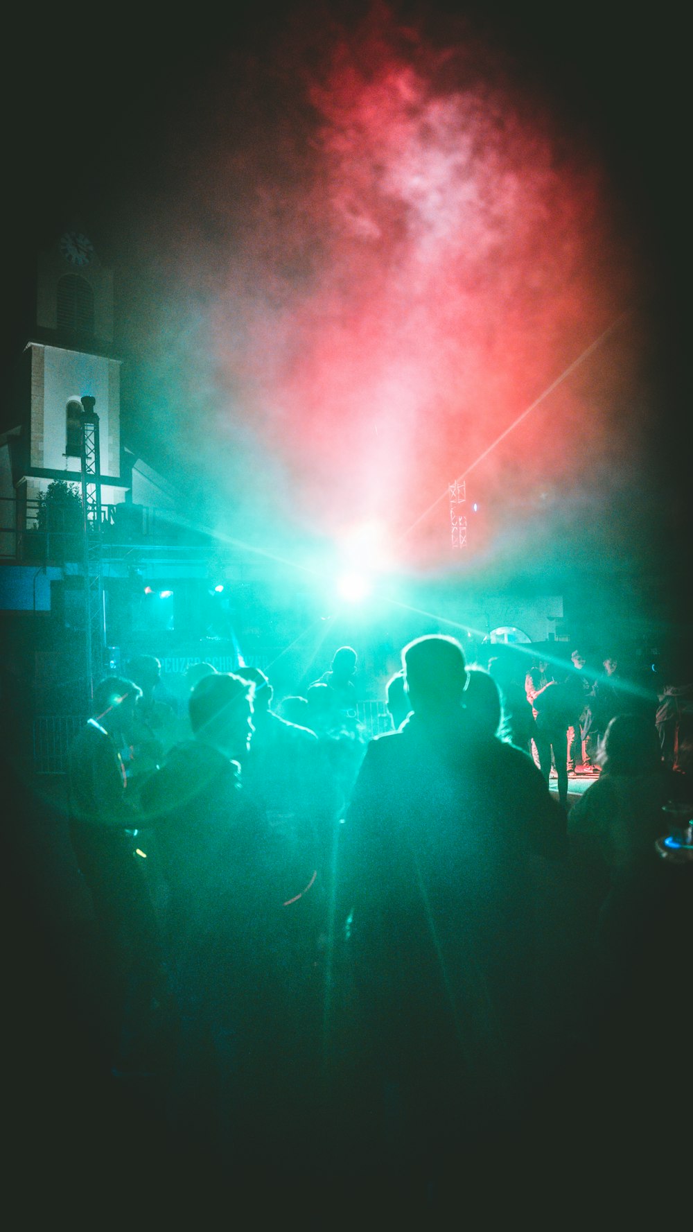 a group of people standing on top of a stage