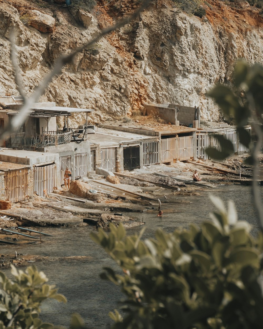 a group of buildings sitting next to a river