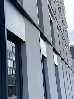 Modern building facade showcasing recent renovation work with precise architectural details