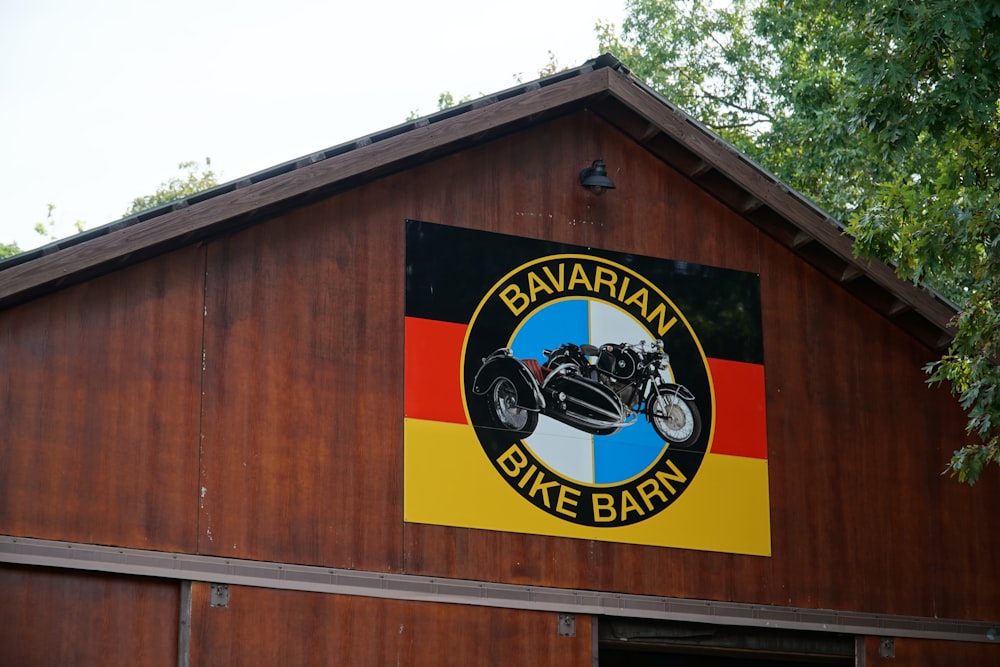 a sign on the side of a wooden building