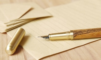 a pen and some papers on a table