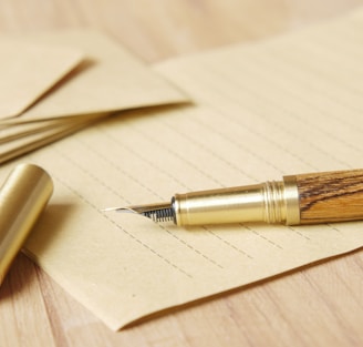 a pen and some papers on a table