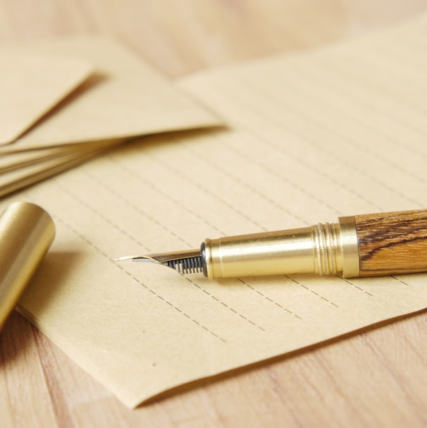 a pen and some papers on a table