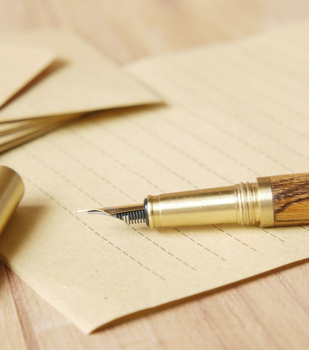 a pen and some papers on a table