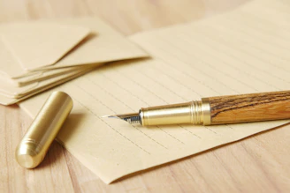 a pen and some papers on a table