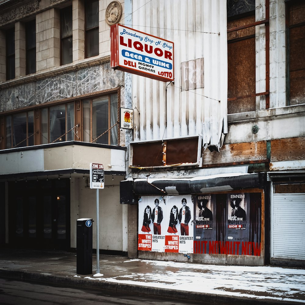 a street corner with a liquor store on the corner