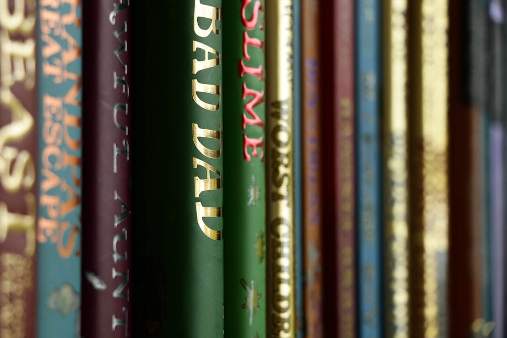 a row of books sitting on top of a shelf