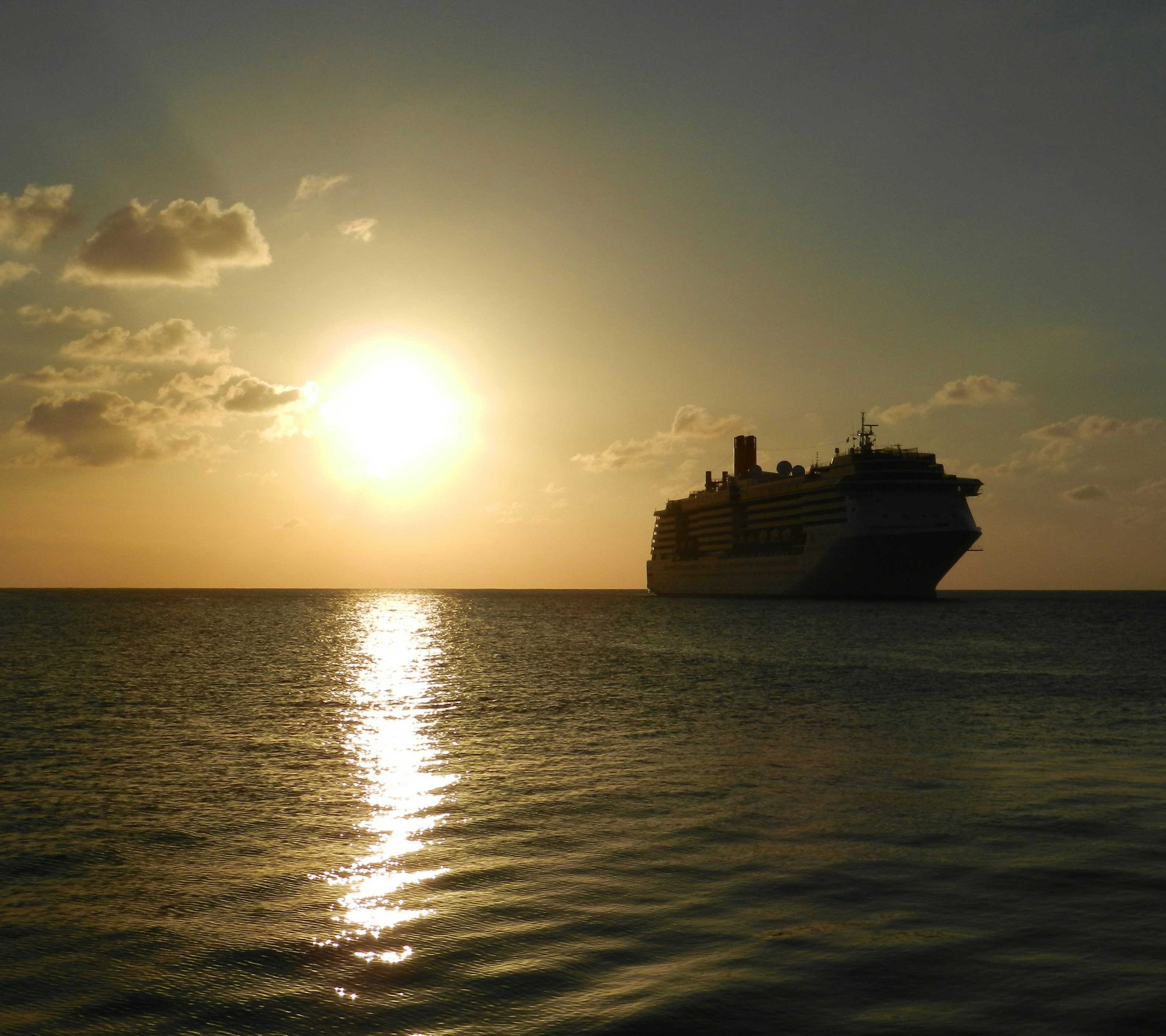 Carnival ship sunset, with a respectful nod to safe travel and dignified care - deaths on carnival cruise ships