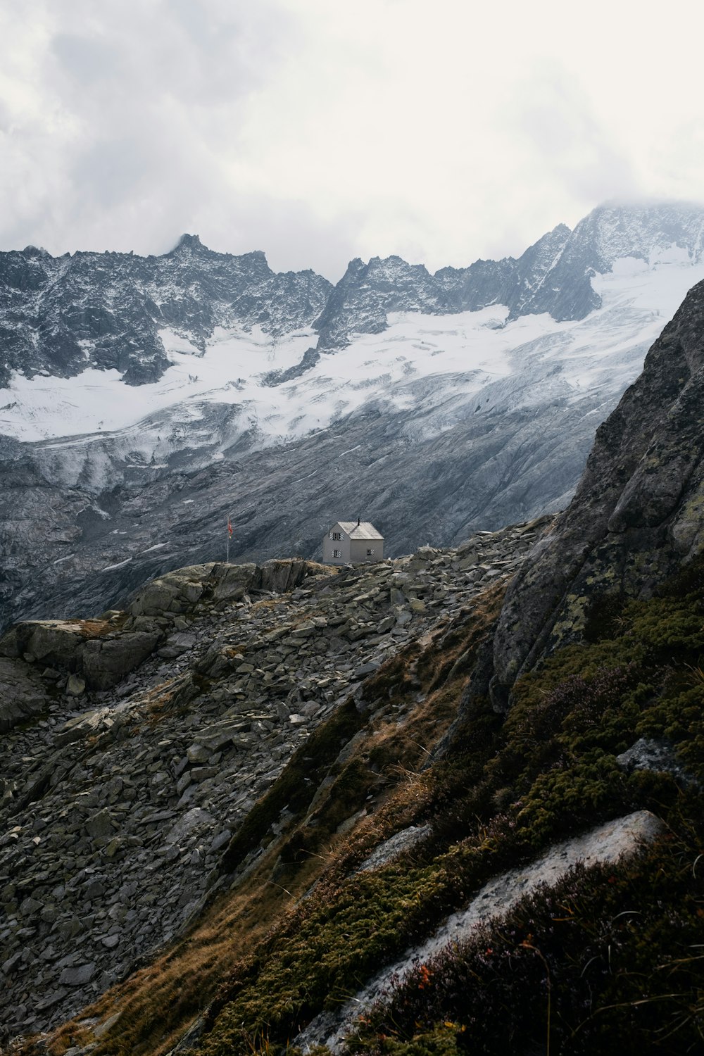 a mountain with a house on top of it