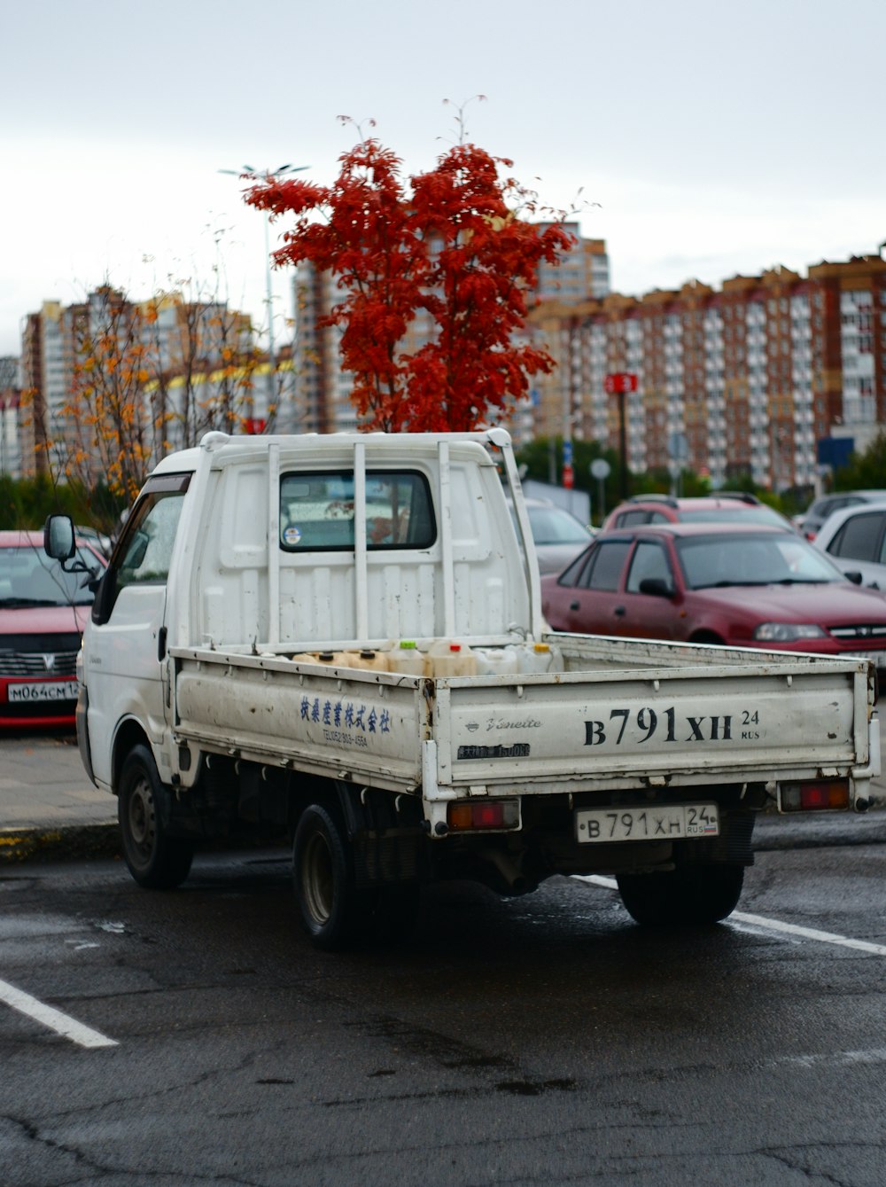 a white pick up truck parked in a parking lot