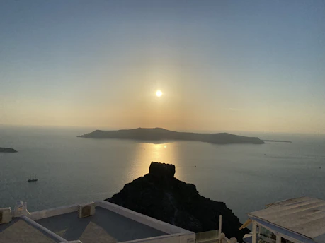 Sunset view over a serene Mediterranean coastline with soft alabaster stone cliffs.