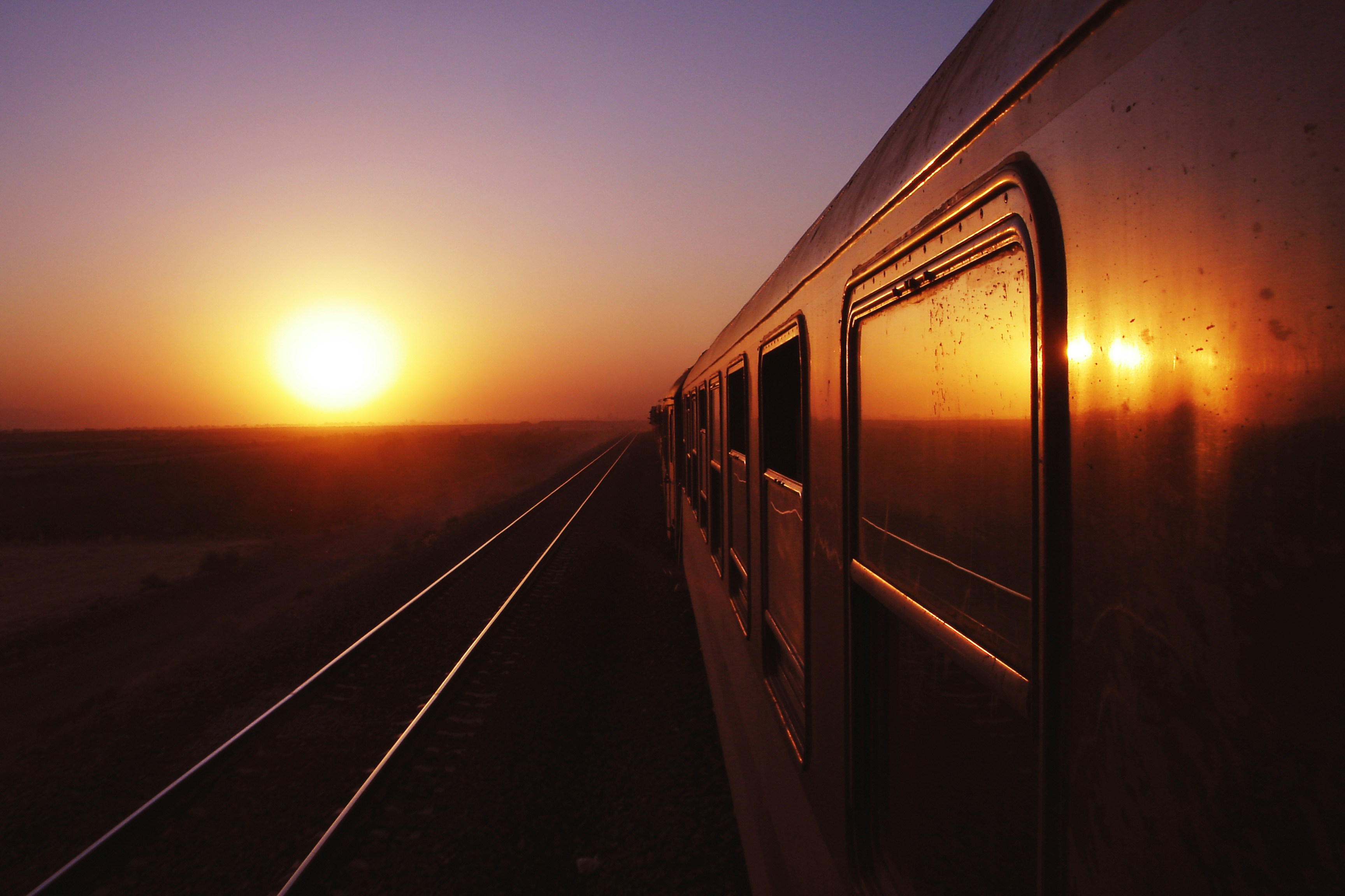 Train traveling towards the sun