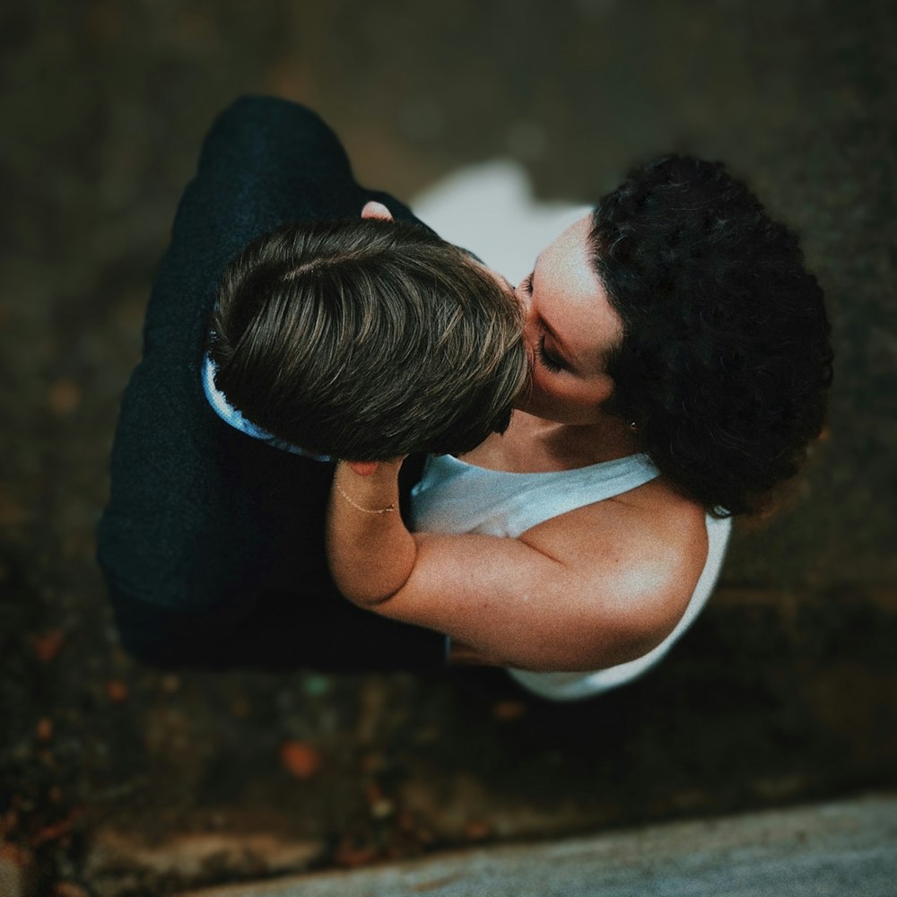a woman kissing a man on the cheek
