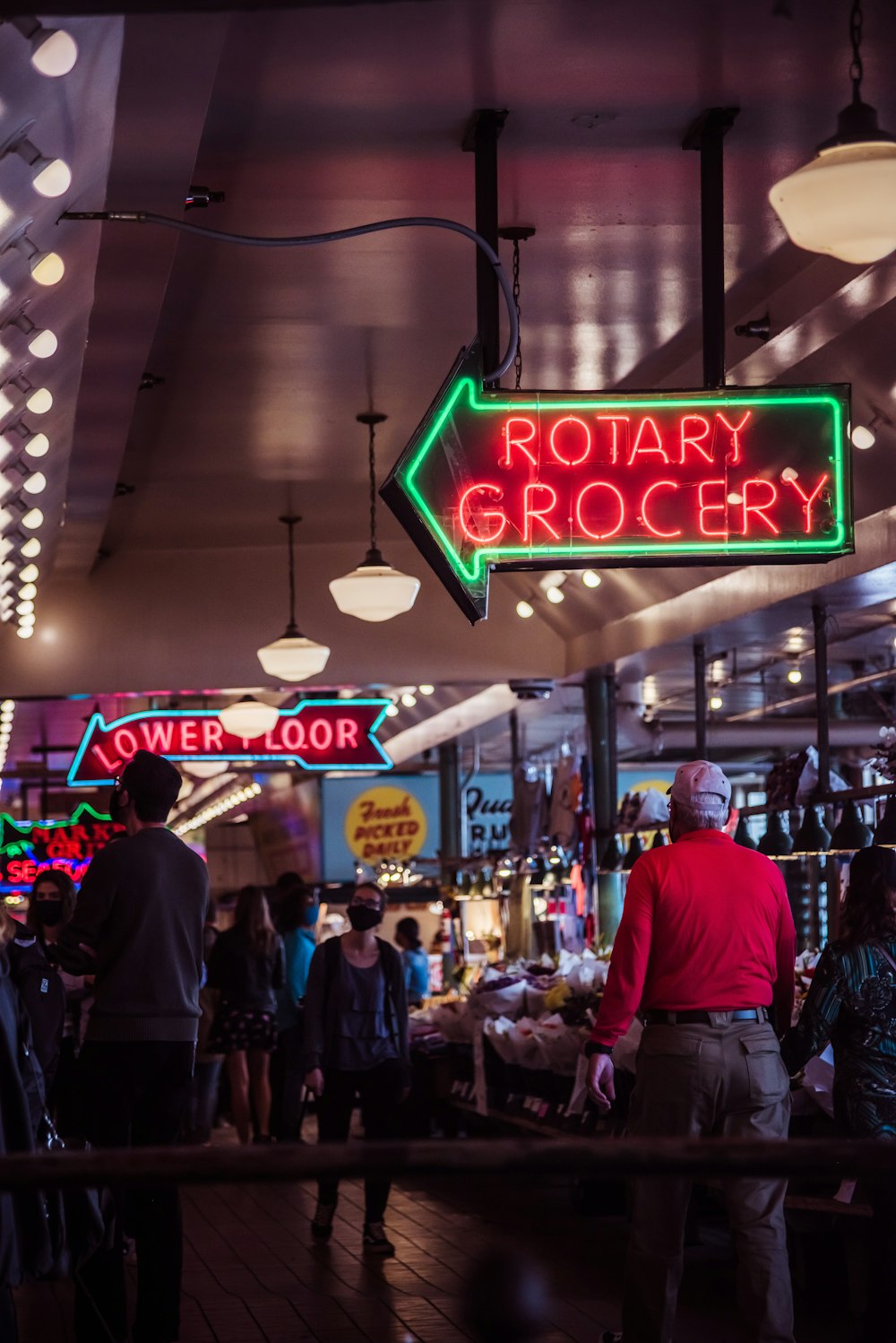 a group of people standing around a store