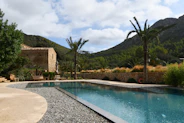 a house with a pool in the middle of it