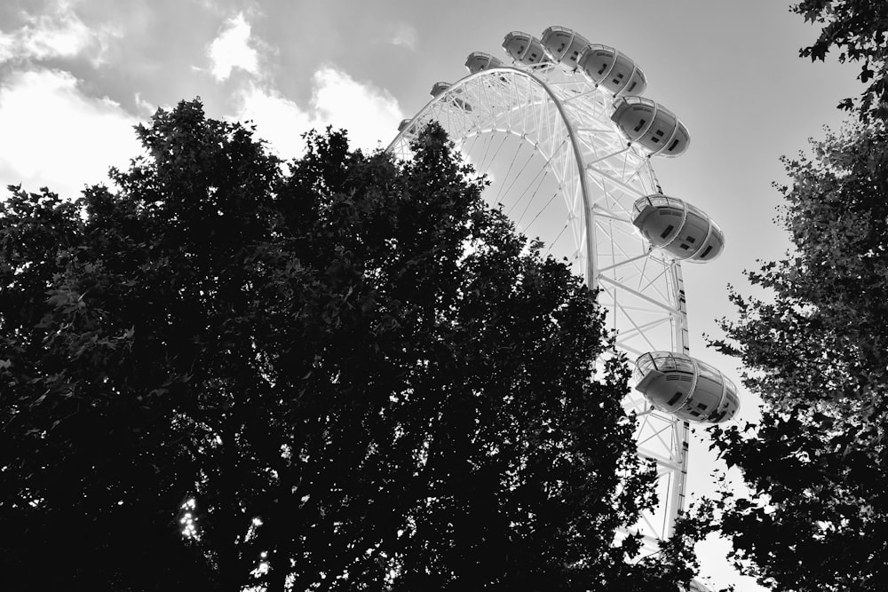 a black and white photo of a ferris wheel