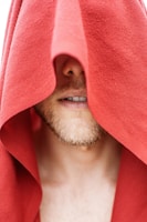 A close-up of a steaming towel ready for a soothing shave.