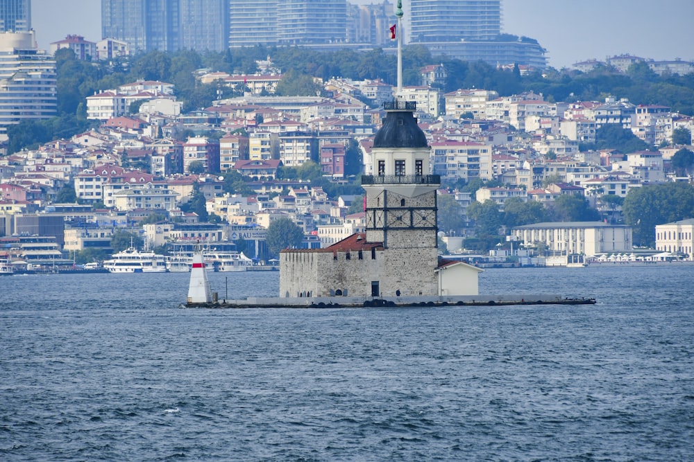 a lighthouse in the middle of a body of water