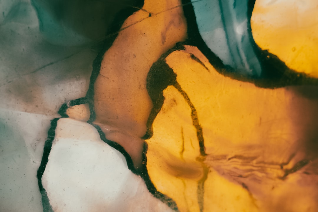 a close up of a banana peel on a table, Stained glass detail.