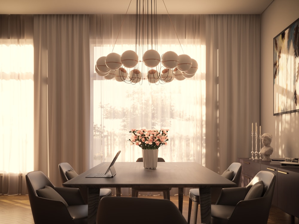 a dining room table with a vase of flowers on it