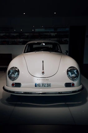 A classic car shining under bright auction lights