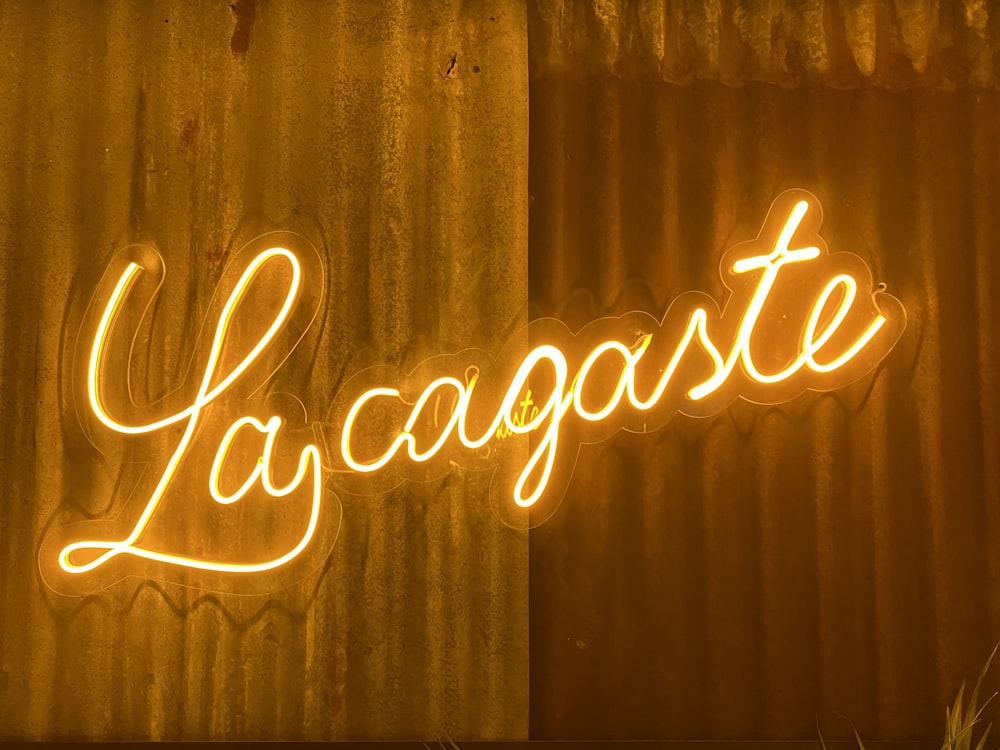 a neon sign that reads lagagate on a wall