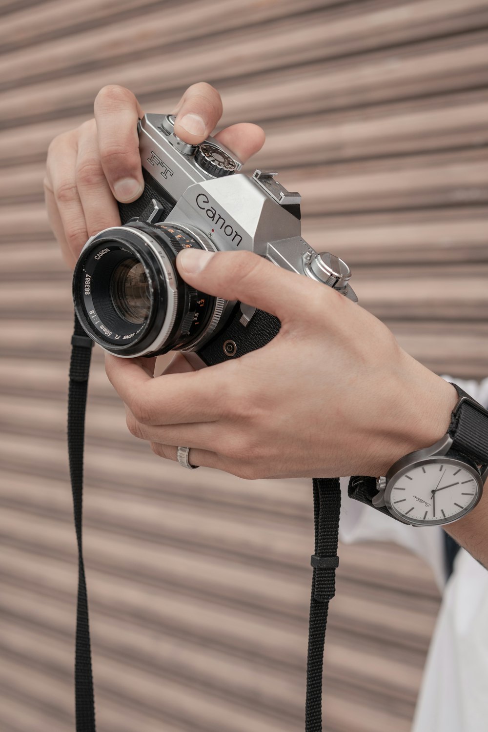 a person holding a camera in their hand