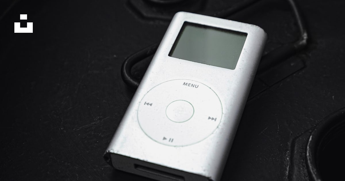 An ipod sitting on top of a black table photo – Free Electronics Image ...