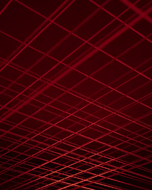 Abstract geometric lines intersecting over a dark background, symbolizing strategic connections.