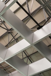 the ceiling of a building with metal beams