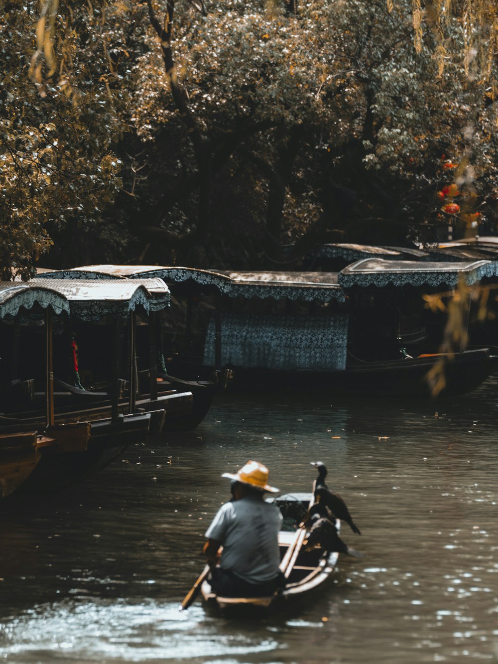 a man on a small boat in a body of water