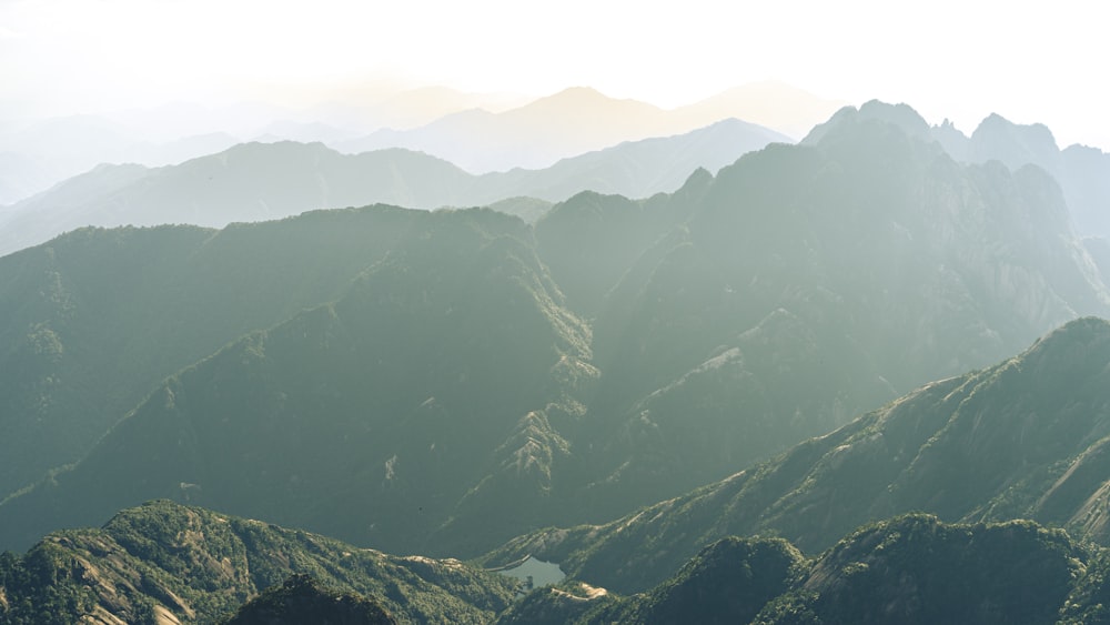 a view of a mountain range with a lake in the middle