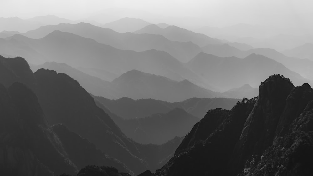 a black and white photo of a mountain range