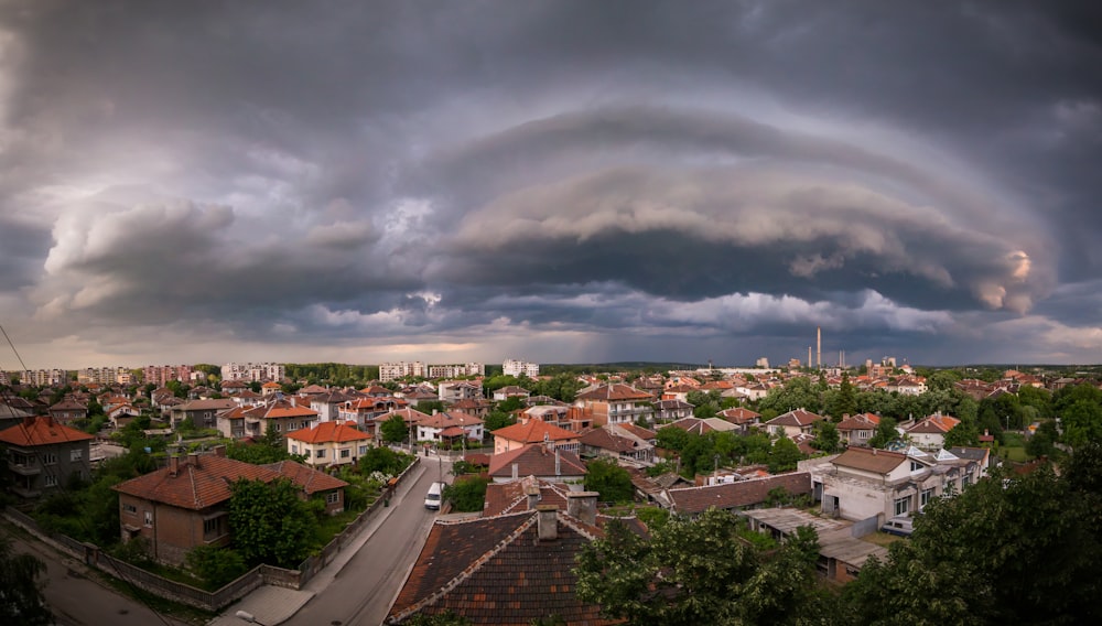 a storm rolls in over a small town