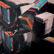 A surreal composition featuring large, abstract cubic structures with vivid textures and colors. A mannequin-like figure is seated on one of the cubes, adding an element of contrast. The scene evokes a sense of disorientation with its impossible geometry and shadow play.