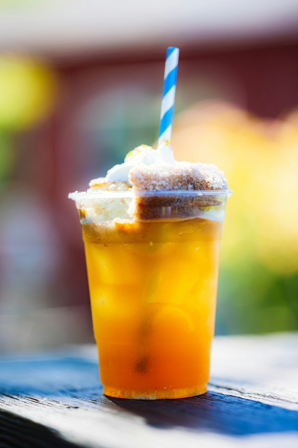 a drink with a straw in it sitting on a table