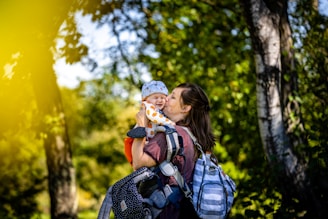 a woman holding a baby in her arms