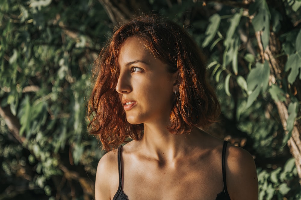 a close up of a woman with red hair