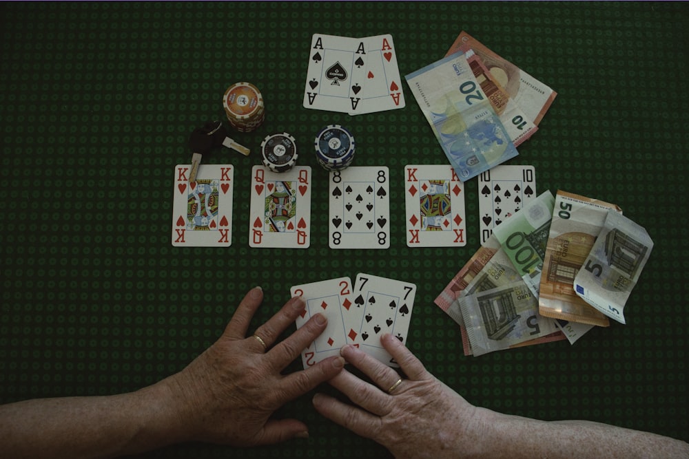 a man is playing a game of cards on a table