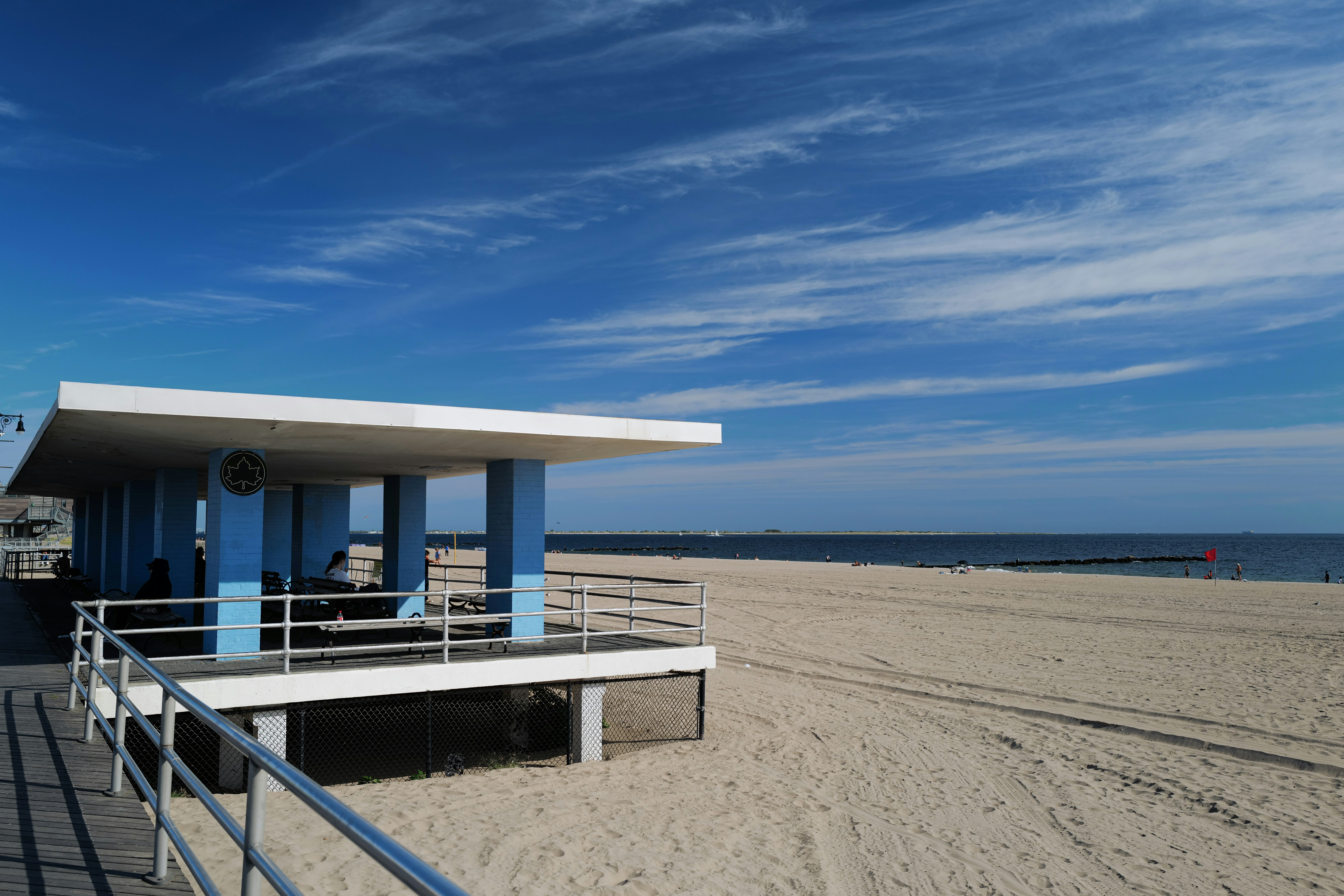 A blue and white building sitting on top of a sandy beach photo – Free ...