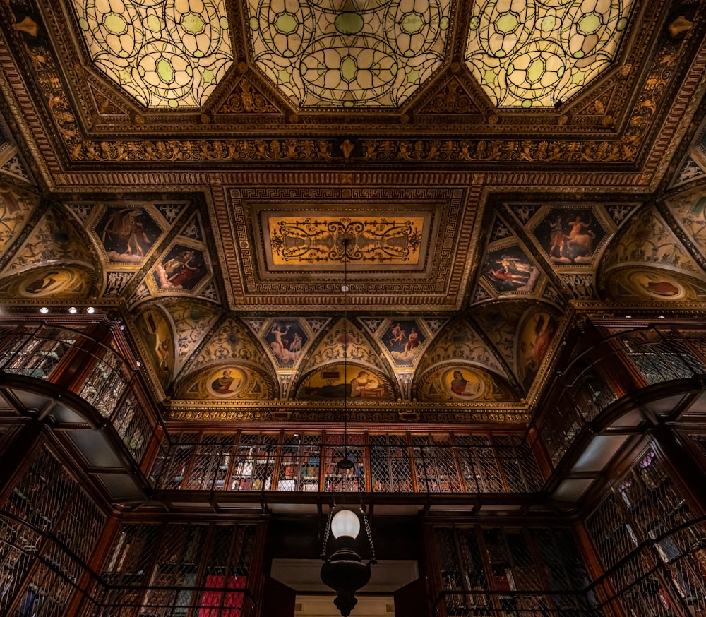 the ceiling of a library filled with lots of books