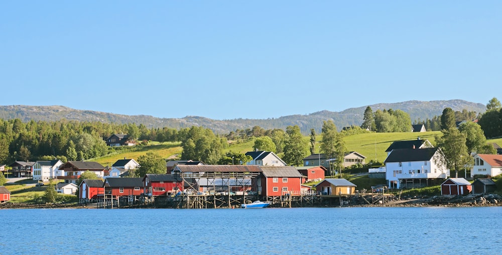 a row of houses next to a body of water