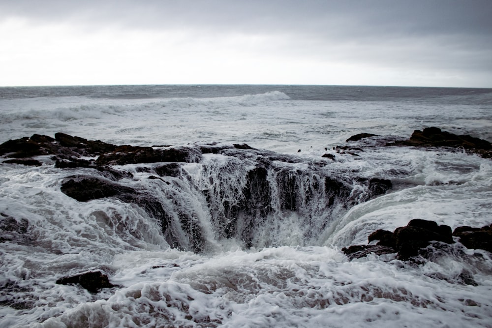 a large body of water surrounded by rocks