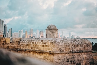 a view of a city from the top of a wall