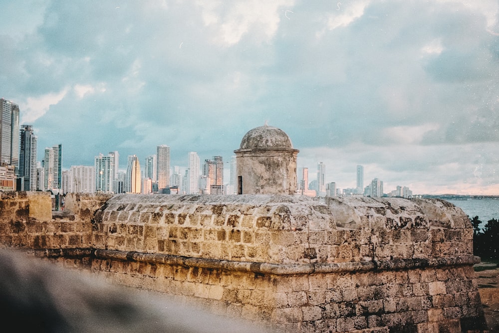 a view of a city from the top of a wall