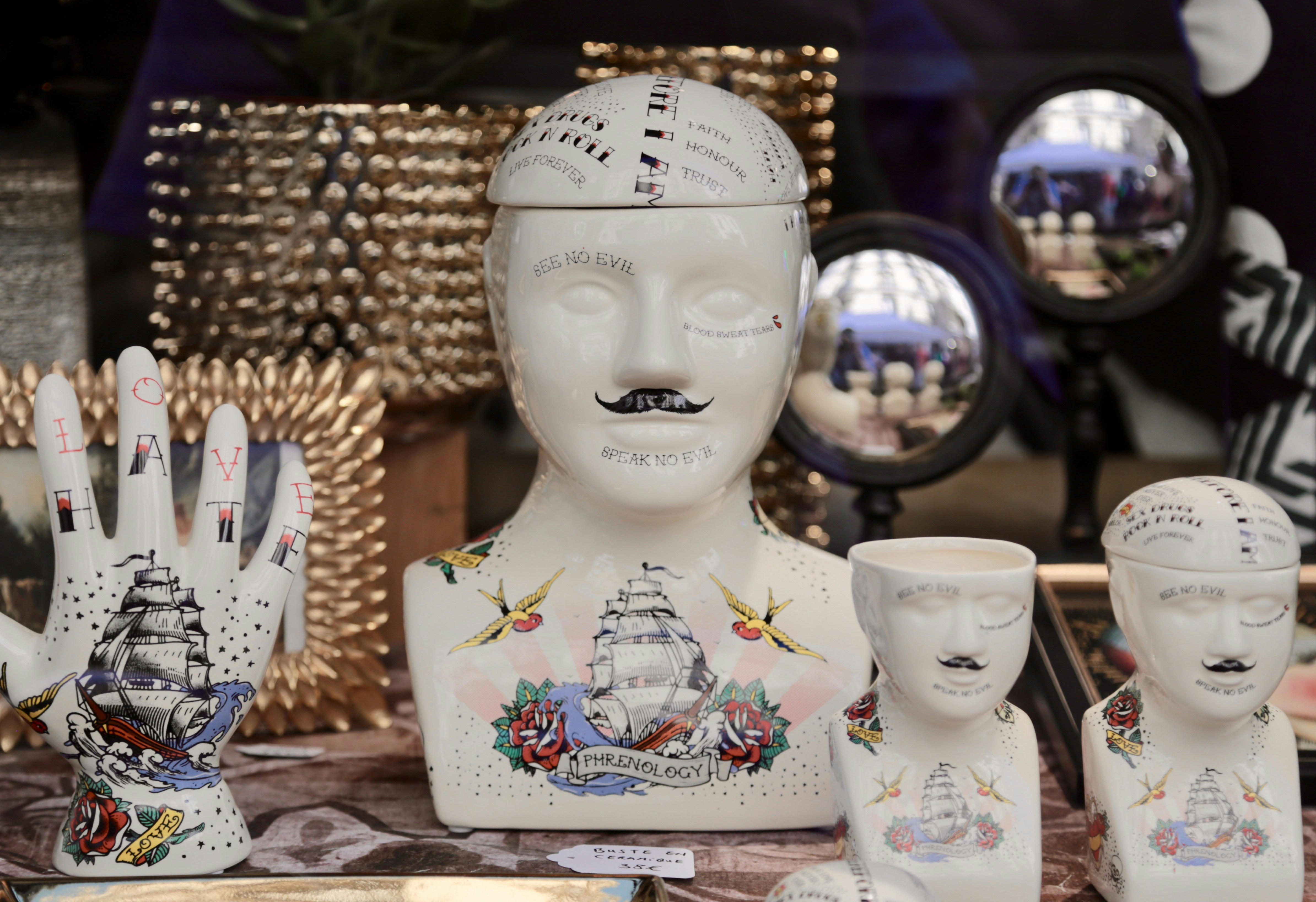 a group of white ceramic figurines sitting on top of a table